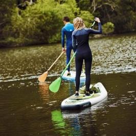 a person riding a surf board on a body of water