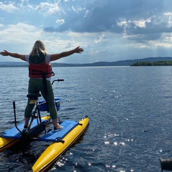 a group of people in a boat on a body of water