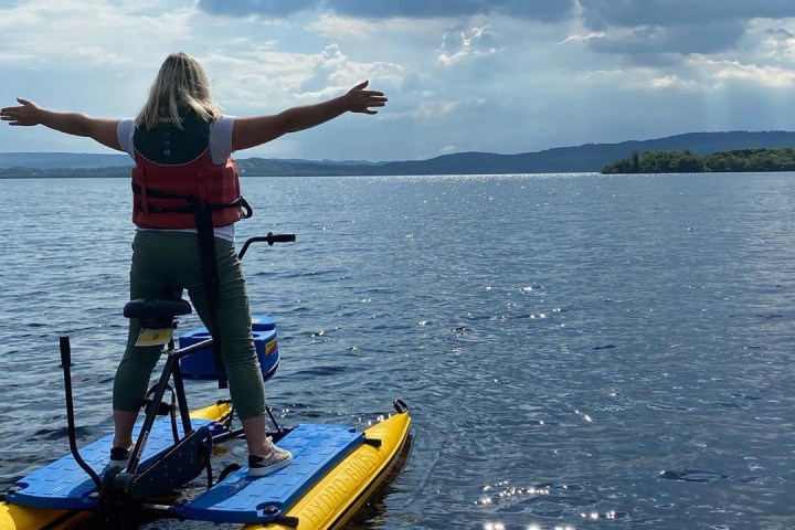 a group of people in a boat on a body of water